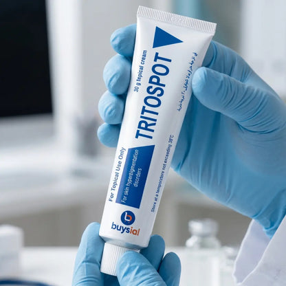Dermatologist holding Buysial TRITOSPOT 30g Topical Cream for Skin Hyperpigmentation Disorders in clinical setting